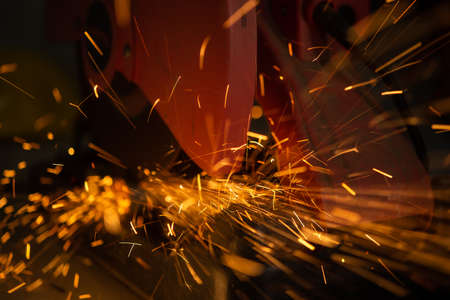 Sparks from tools, use hacksaw or cutting steel partsの写真素材
