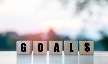 The word goals on a wooden cube, the concept of setting goals for success.の写真素材