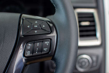 Push button to control the speed of the car on the steering wheel. Technology to facilitate drivingの写真素材