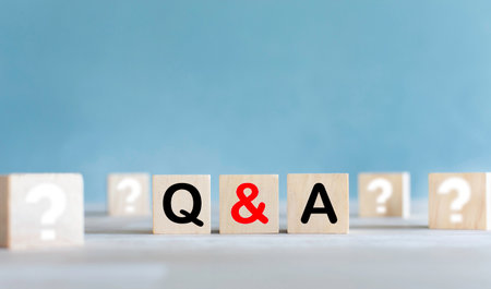 Letters Q and A on a wooden cube Concept of asking questions and answersの写真素材
