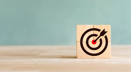 target darts icon on wooden cube Setting business goals and success ideas Focus on goals and achieve a successful business. planning to achieve goalsの写真素材