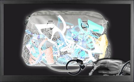 Xray airport scanner for tourism and business travel industry scanning a bag of woman shoesの写真素材