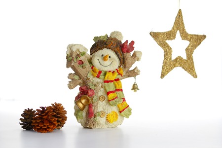 Ceramic Snowman with Christmas decoration on whiteの写真素材