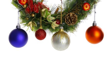 Globes hanging a Christmas wreath isolate on white backgroundの写真素材
