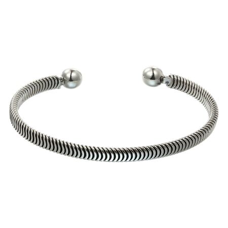 Ornate silver bracelet, isolated on white a backgroundの写真素材