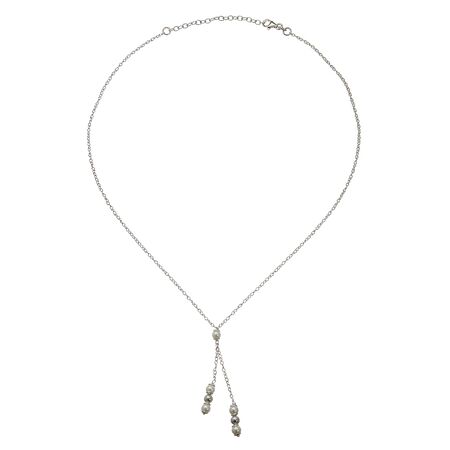 A silver chain with tassels on white backgroundの写真素材