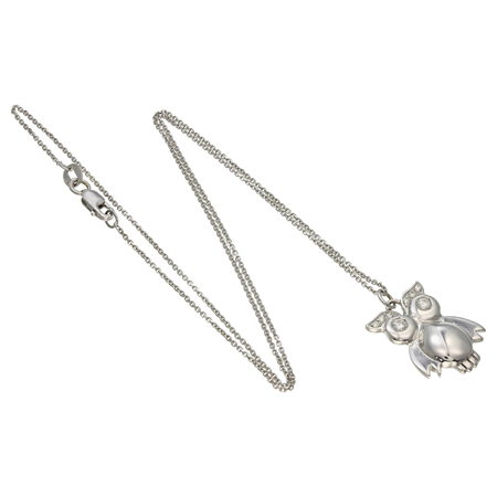 White gold chain with pendant in the shape of a owlの写真素材