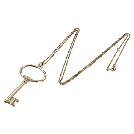 Gold chain with pendant in the shape of a keyの写真素材