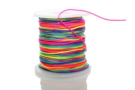 The cylinder of colored cord on white background