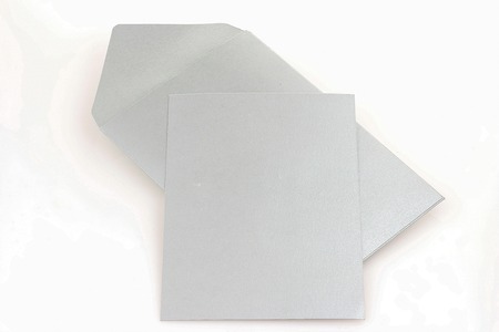 Grey envelope with blank grey card isolated on white backgroundの写真素材