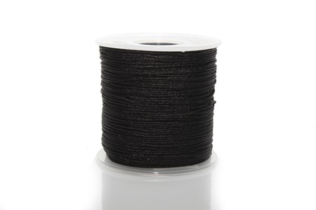 The cylinder of colored cord on white backgroundの写真素材