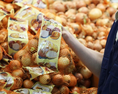A seller who chooses onion bagの写真素材