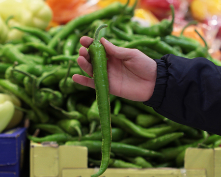 A seller who chooses fruits / vegetables in the supermarketの写真素材