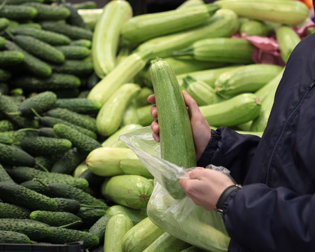 A seller who chooses fruits / vegetables in the supermarketの写真素材