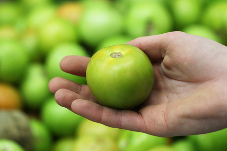 A seller who chooses fruits / vegetables in the supermarketの写真素材