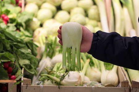A seller who chooses fruits / vegetables in the supermarketの写真素材