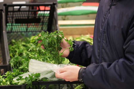 A seller who chooses fruits / vegetables in the supermarketの写真素材