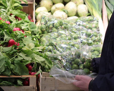 A seller who chooses fruits / vegetables in the supermarketの写真素材