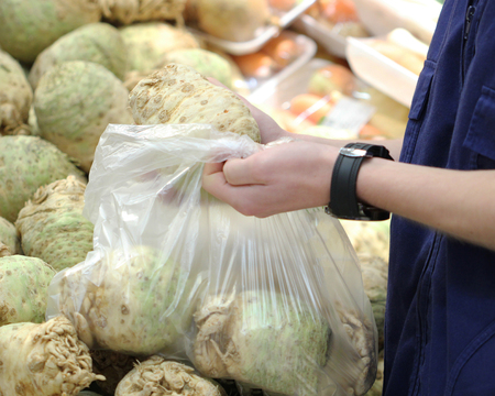 A seller who chooses a vegetableの写真素材