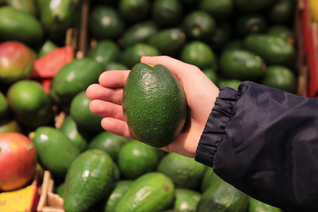 A seller who chooses fruits / vegetables in the supermarketの写真素材