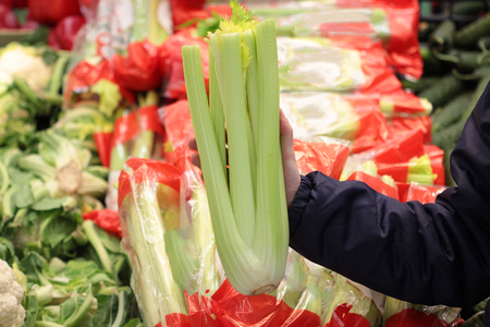 A seller who chooses fruits / vegetables in the supermarketの写真素材