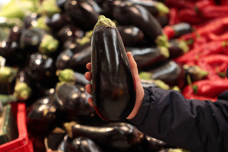 A seller who chooses fruits / vegetables in the supermarketの写真素材