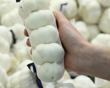 A seller who chooses a garlicの写真素材