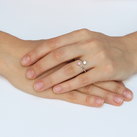 A woman's hand with silver rings and colored semi-precious stonesの写真素材