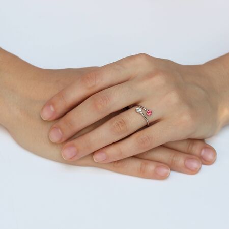 A woman's hand with silver rings and colored semi-precious stonesの写真素材