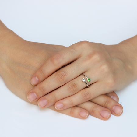 A woman's hand with silver rings and colored semi-precious stonesの写真素材