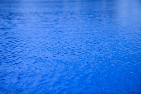 blue wavy swimming pool water for backgroundの写真素材