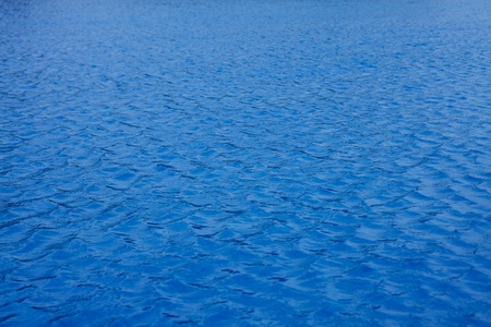 blue wavy swimming pool water for backgroundの写真素材