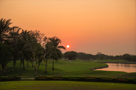 Beautiful golf course during sunset for backgroundの写真素材
