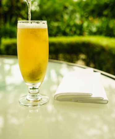 a glass of golden bear  at hotel balconyの写真素材