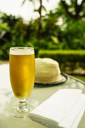a glass of golden bear  at hotel balconyの写真素材