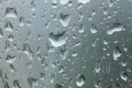 Close up of water drops on window glassの写真素材