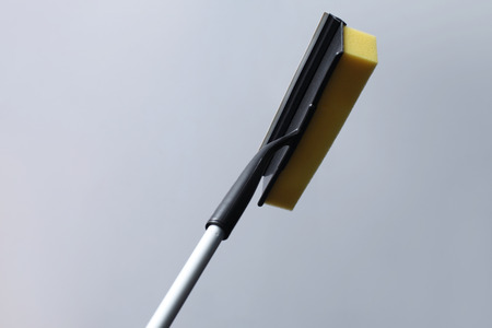 Yellow wiper for cleaning windowの写真素材