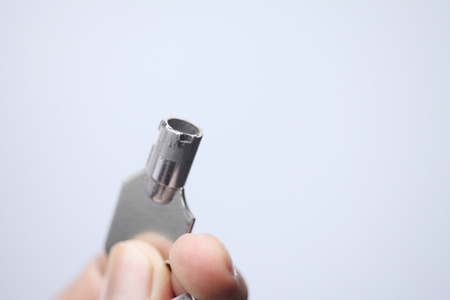 Hand holding a tubular keyの写真素材