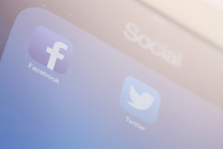 close-up of tablet with social media iconのeditorial素材