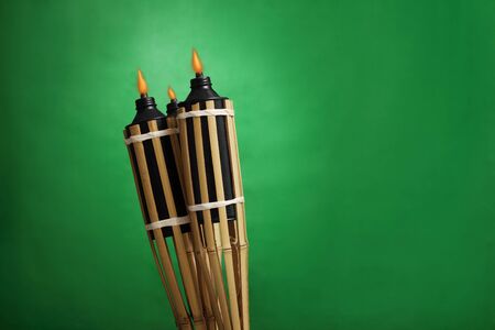 Pelita or oil lamp on gradient green background.の写真素材