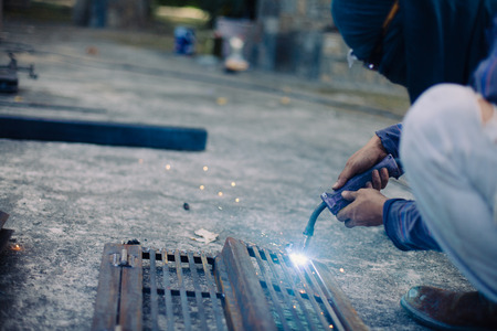Man welding a metal objectの写真素材