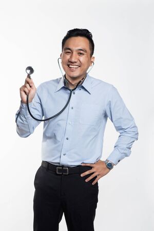 Professional asian doctor holding stethoscope for check-upの写真素材