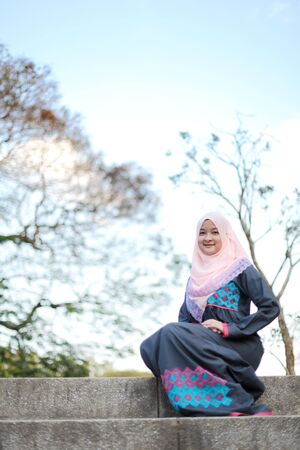 Muslim lady posing and smiling happilyの写真素材