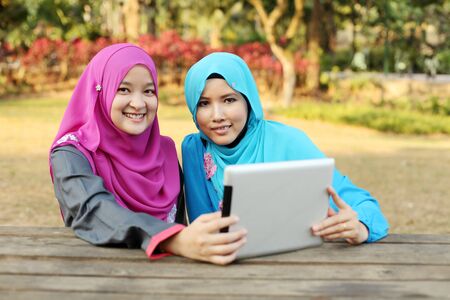Muslim lady working on smilingの写真素材