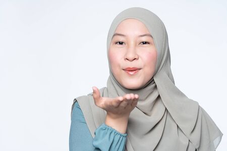 Muslim woman doing flying kiss pose.の写真素材