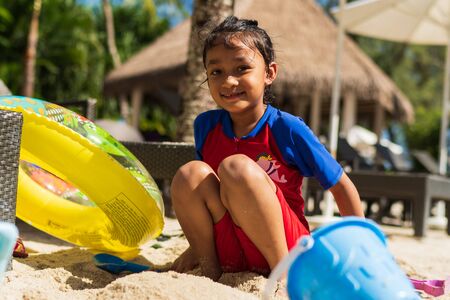 Kids playing with beach sand with they toysの写真素材