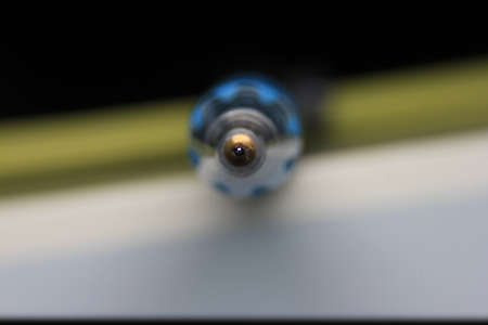 A closeup shot of a pencil on a black background with blurred backgroundの写真素材