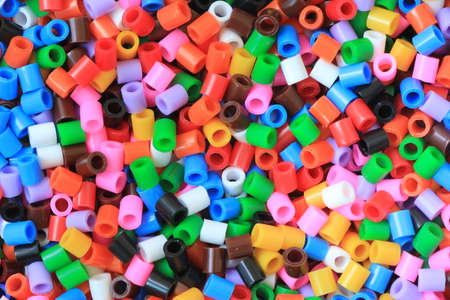 Colorful plastic dowels for the construction of pipes. Background.