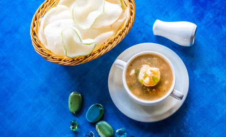 Seafood soup thai style with prawn served with crackersの写真素材