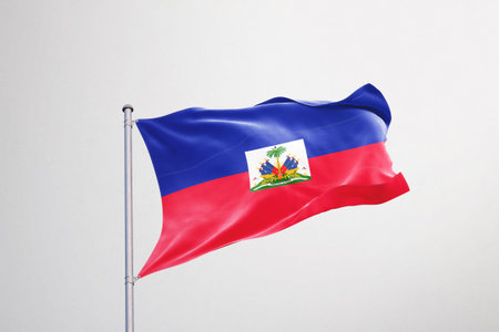 Haiti flag waving in the wind isolated on white background.の写真素材